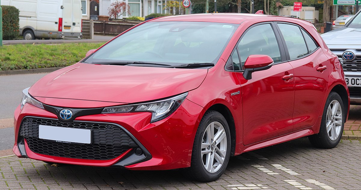 A hatchback photographed on a city street.