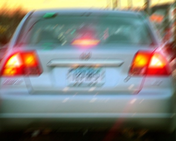 A motion-blurred license plate from a CCTV grab.